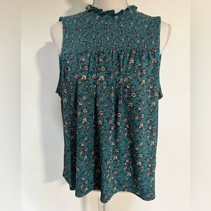 Sleeveless smocked top with ruffle collar